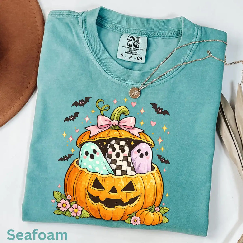 Black Comfort Colors T-shirt mockup showing Preppy Pumpkin Ghost Halloween design
