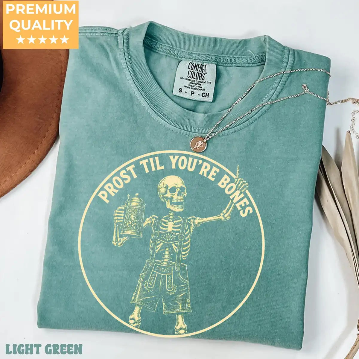 Woman wearing Moss Prost Til Youre Bones - Oktoberfest Skeleton Halloween Comfort Colors T-Shirt
