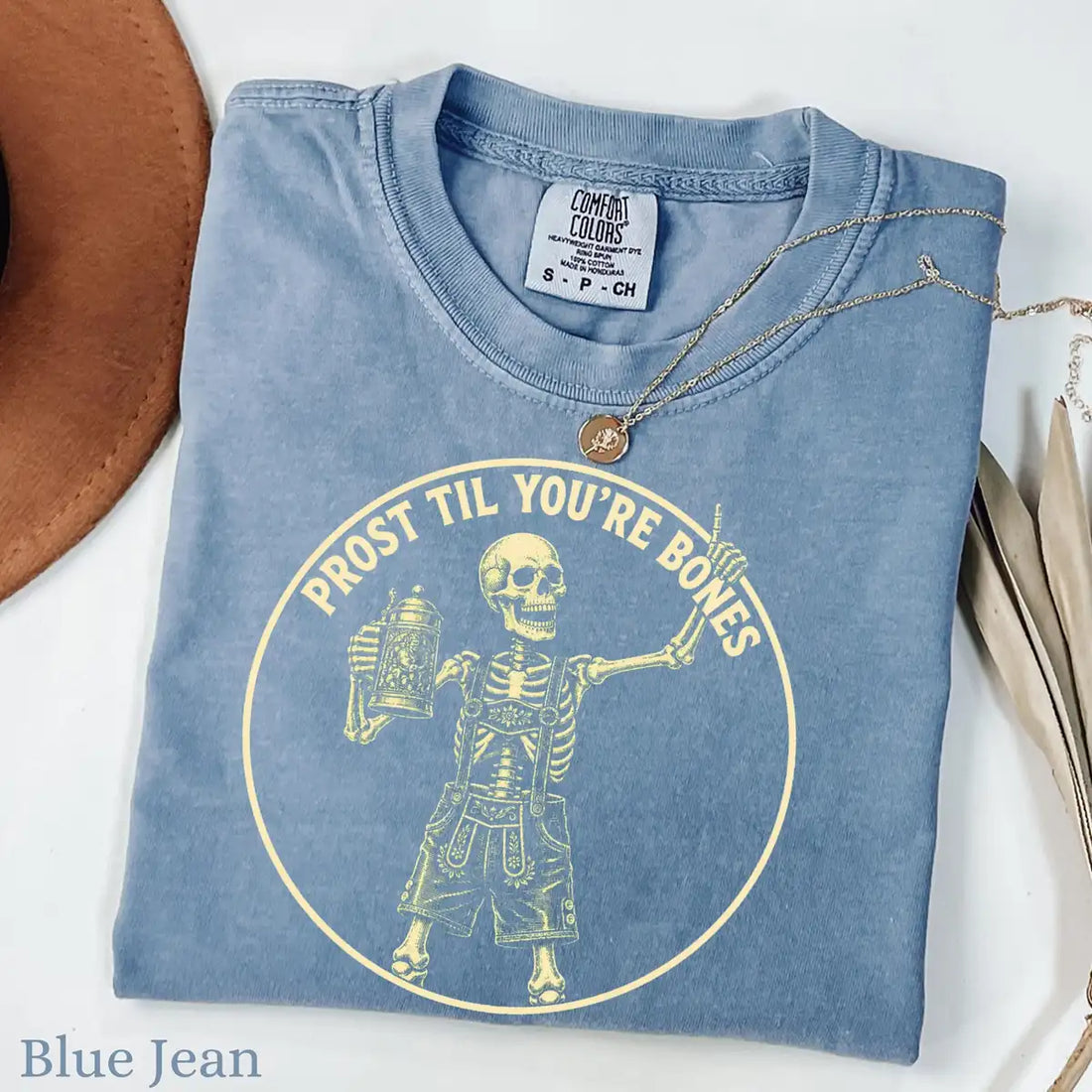 Woman wearing Blue Prost Til Youre Bones - Oktoberfest Skeleton Halloween Comfort Colors T-Shirt