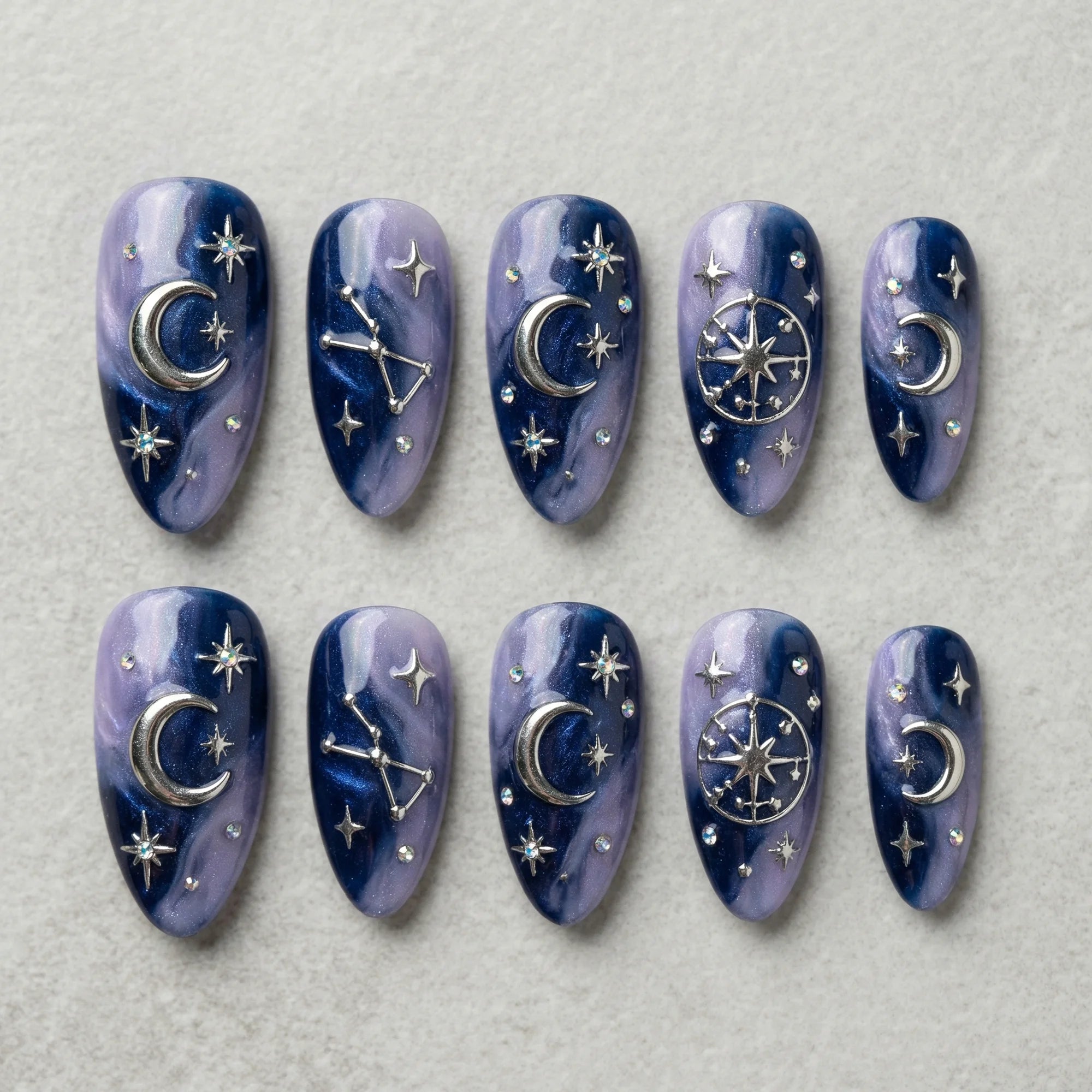 purple marble almond medium press on nails silver astrology flat lay 01