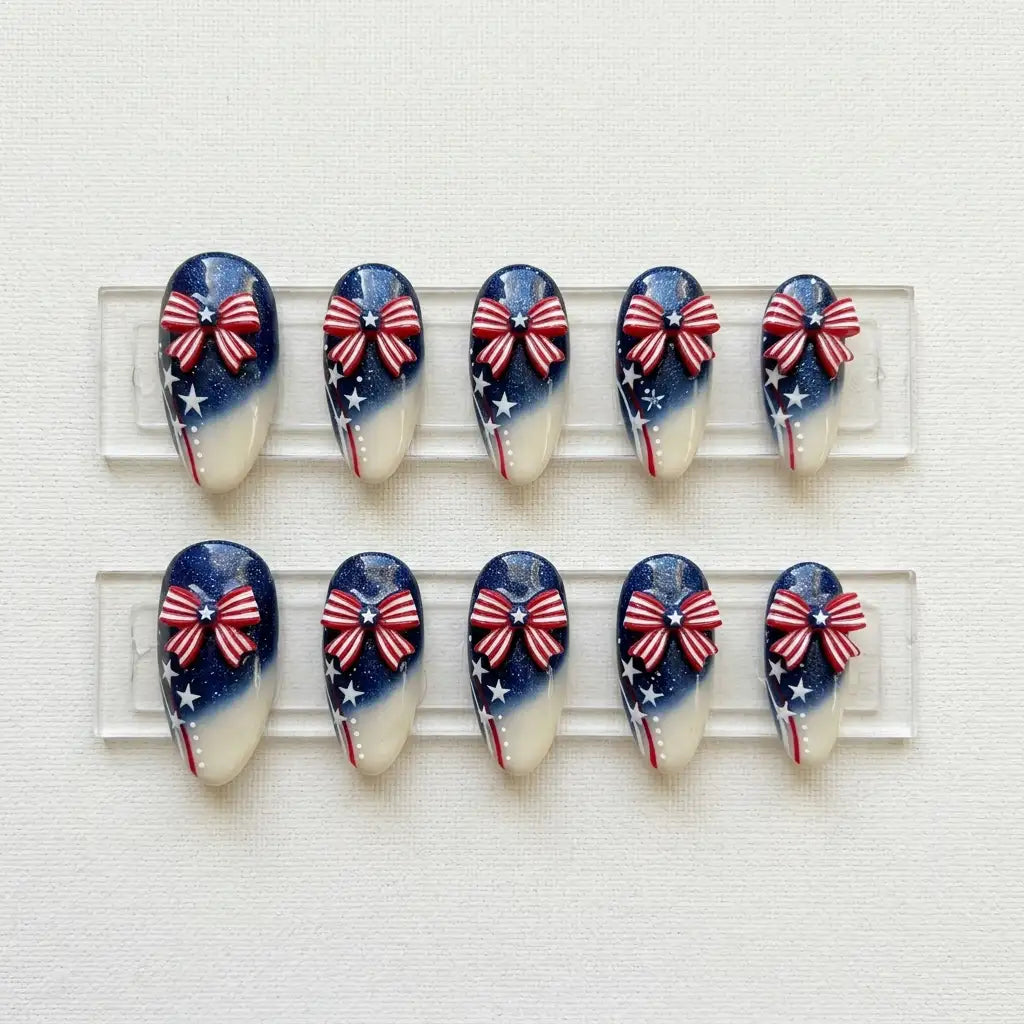 red white blue 3d ombre 4th of july almond press on nails ribbon bow star glitter flat lay 04