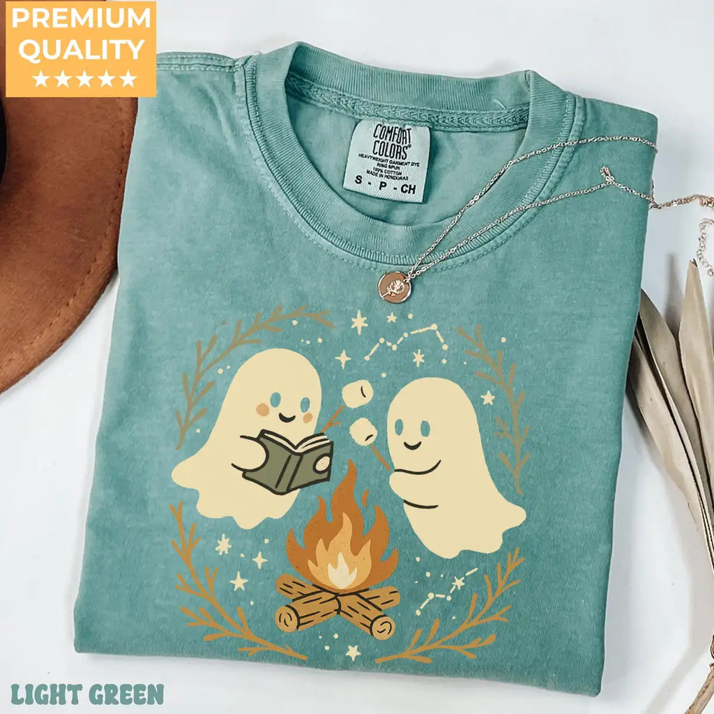 Blue Comfort Colors T-shirt mockup showing Retro Ghost Reading Books Halloween design