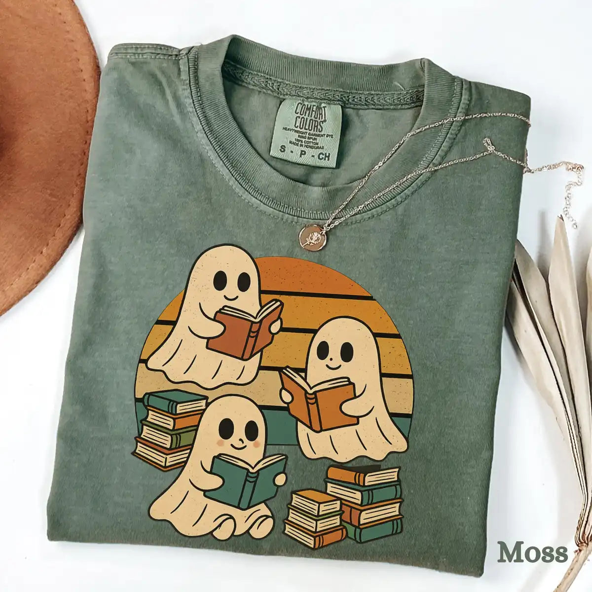 Moss Comfort Colors T-shirt mockup showing Retro Ghost Reading Books Halloween design