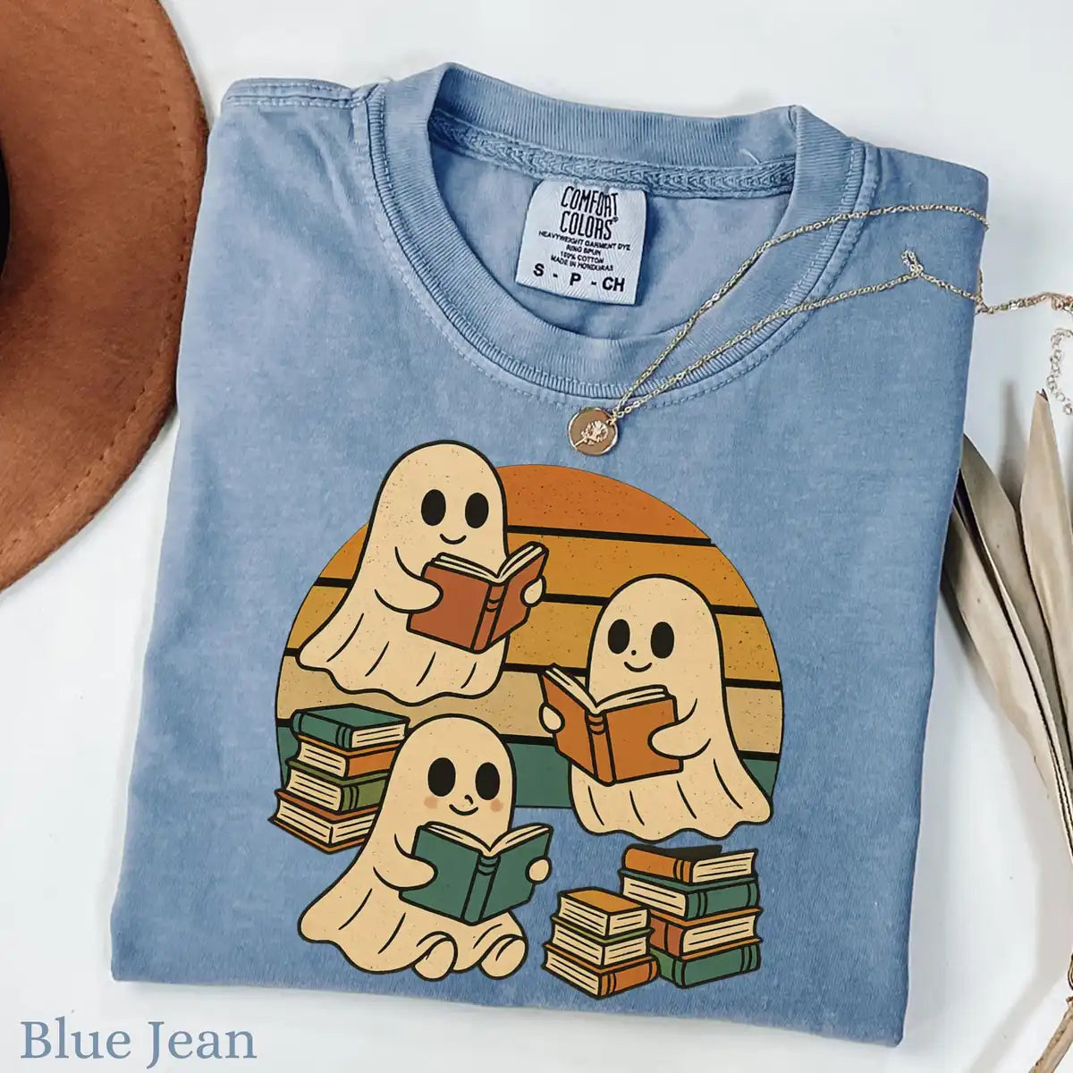 Comfort Colors T-shirt mockup showing Retro Ghost Reading Books Halloween design