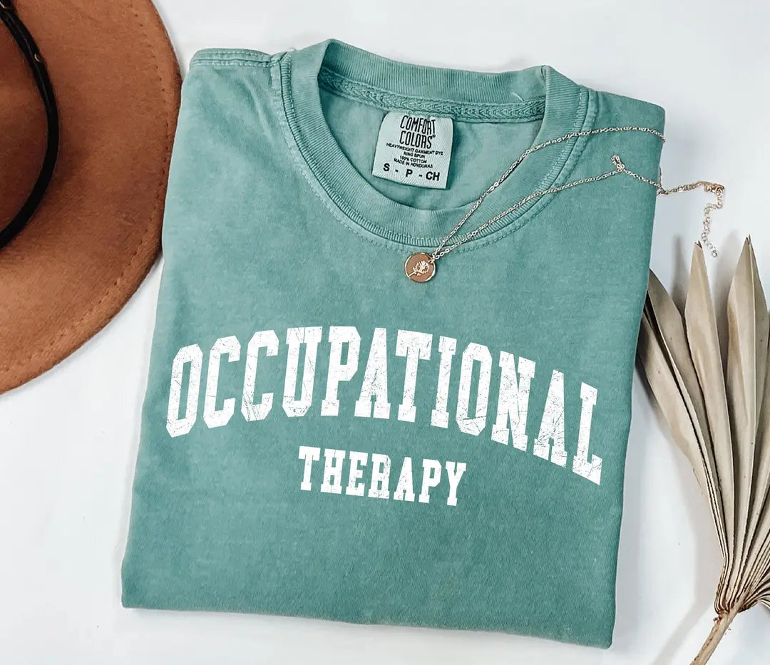 Seafoam Comfort Colors 1717 tee with retro collegiate OCCUPATIONAL THERAPY text printed in white.