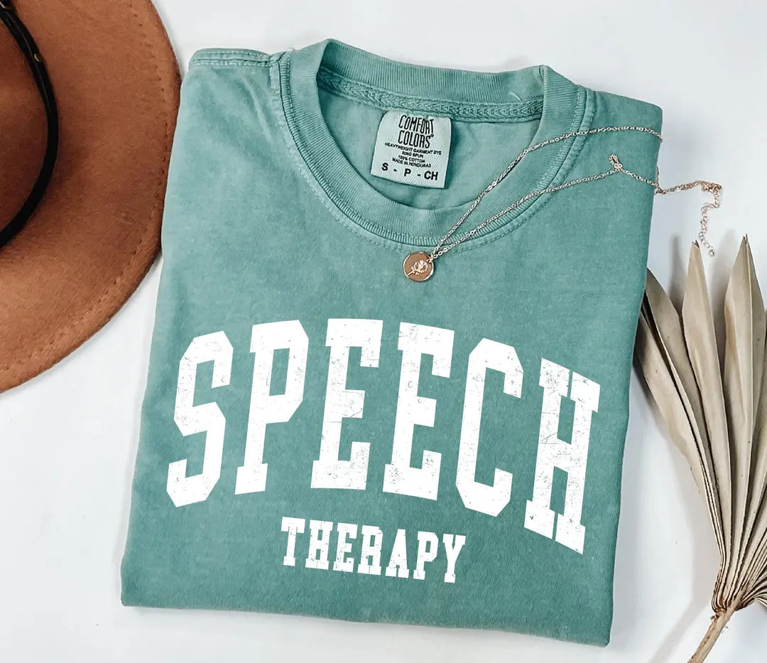 Seafoam Comfort Colors 1717 tee with retro collegiate SPEECH THERAPY text printed in white.