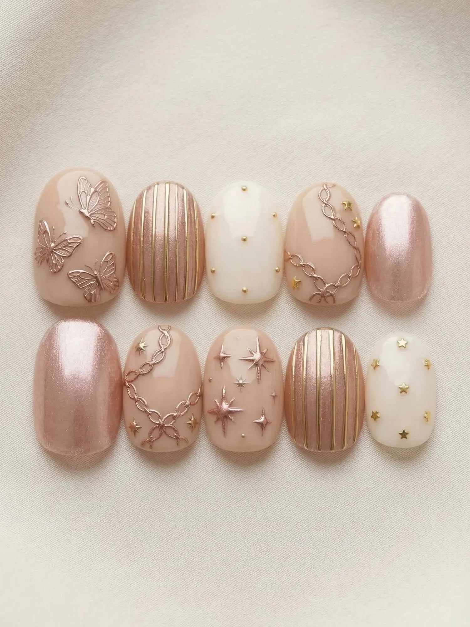 rose gold chrome almond medium press on nails flat lay 01
