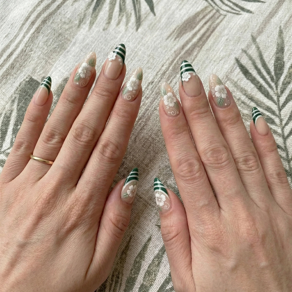 sage green hand painted almond medium press on nails hibiscus flower stripe detail 04