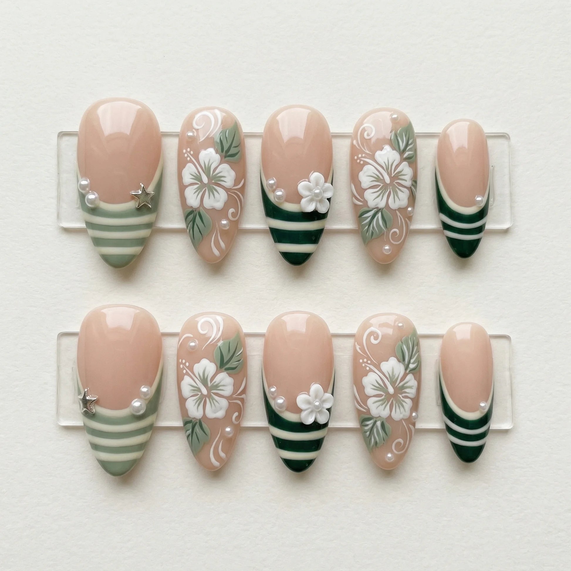 sage green hand painted almond medium press on nails hibiscus flower stripe flat lay 01