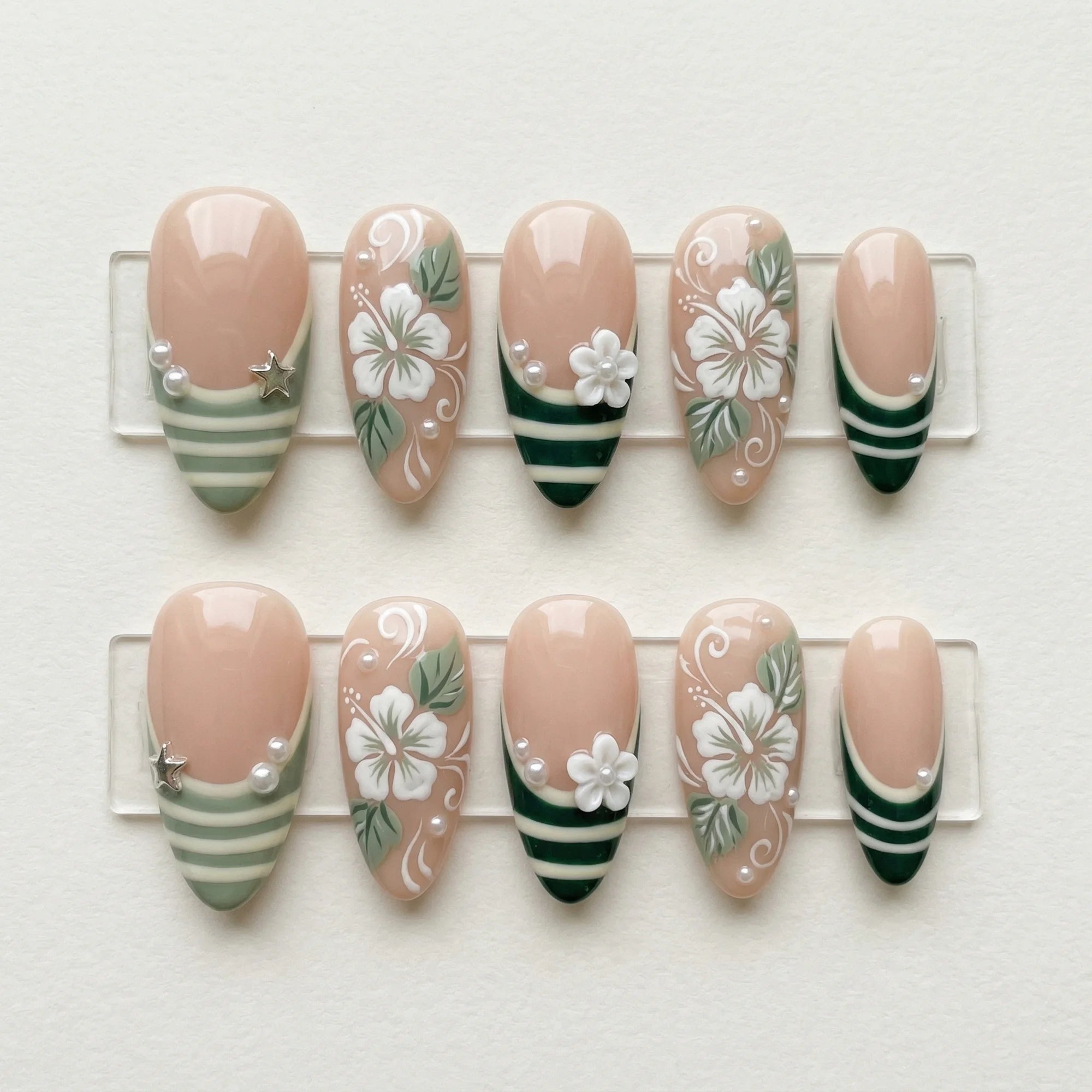 sage green hand painted almond medium press on nails hibiscus flower stripe flat lay 01