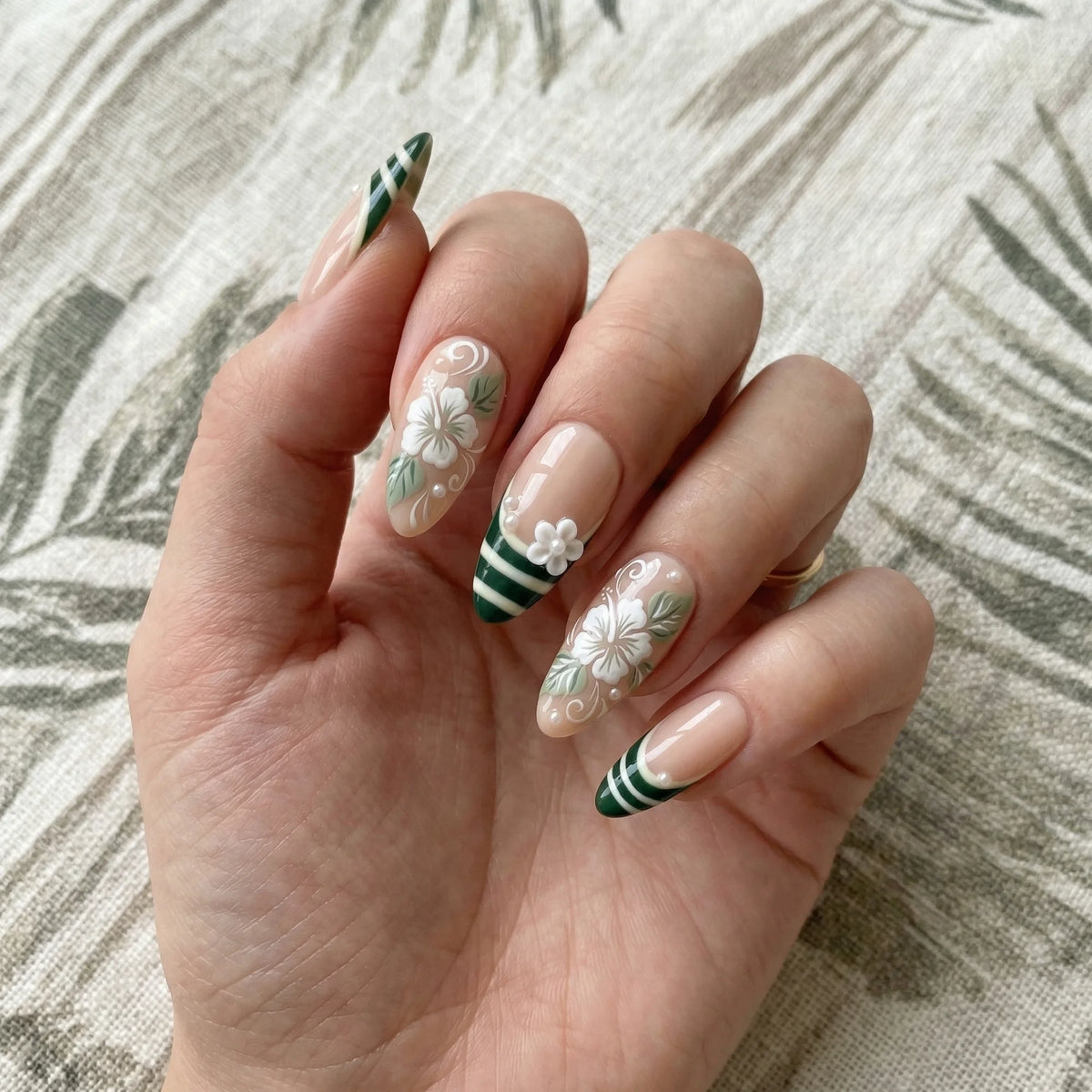 sage green hand painted almond medium press on nails hibiscus flower stripe lifestyle 02
