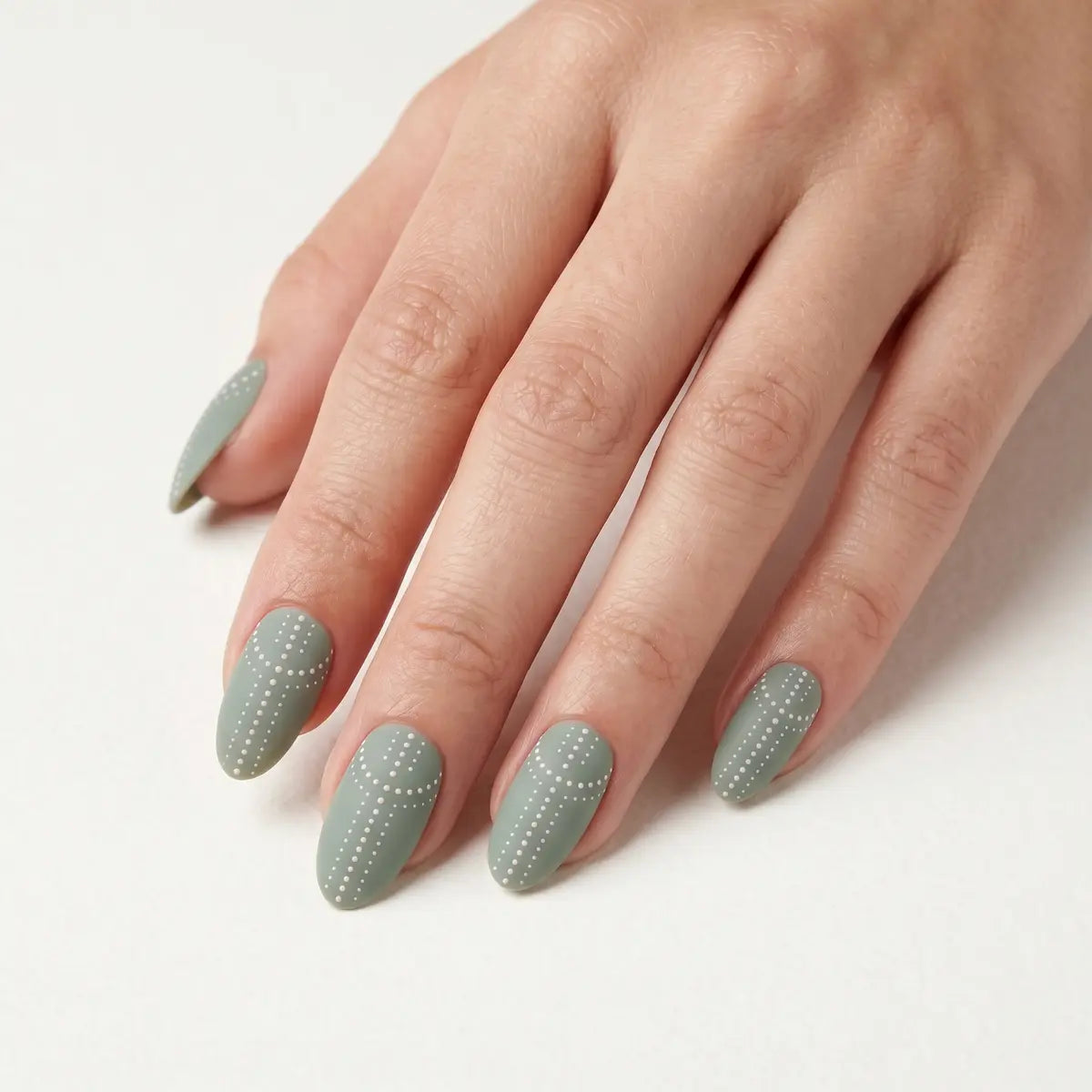sage green hand painted almond press on nails white dot cross lifestyle 02