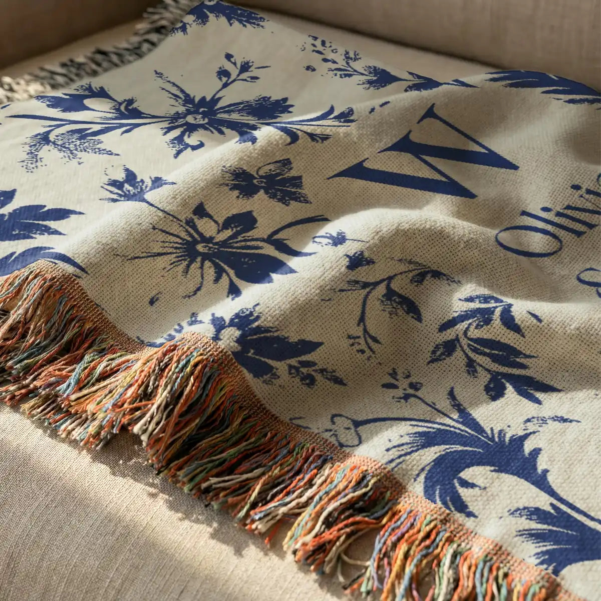 Personalized scenic toile woven blanket with monogram shown in a styled room setting
