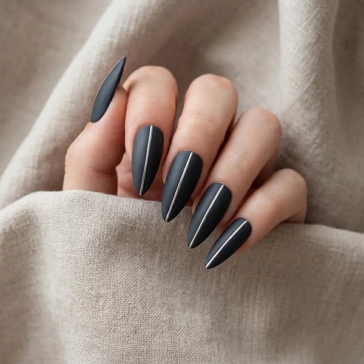 slate grey hand painted almond press on nails silver stripe flat lay 04