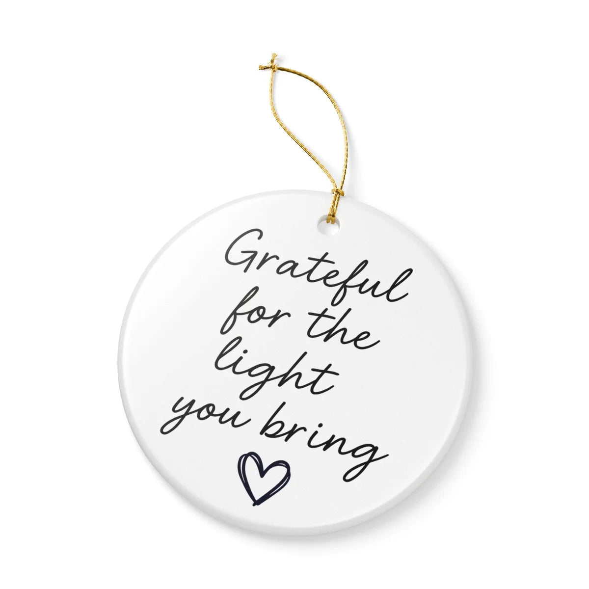 Alternate view of a round ceramic ornament with the visible Grateful for the Light You Bring message.