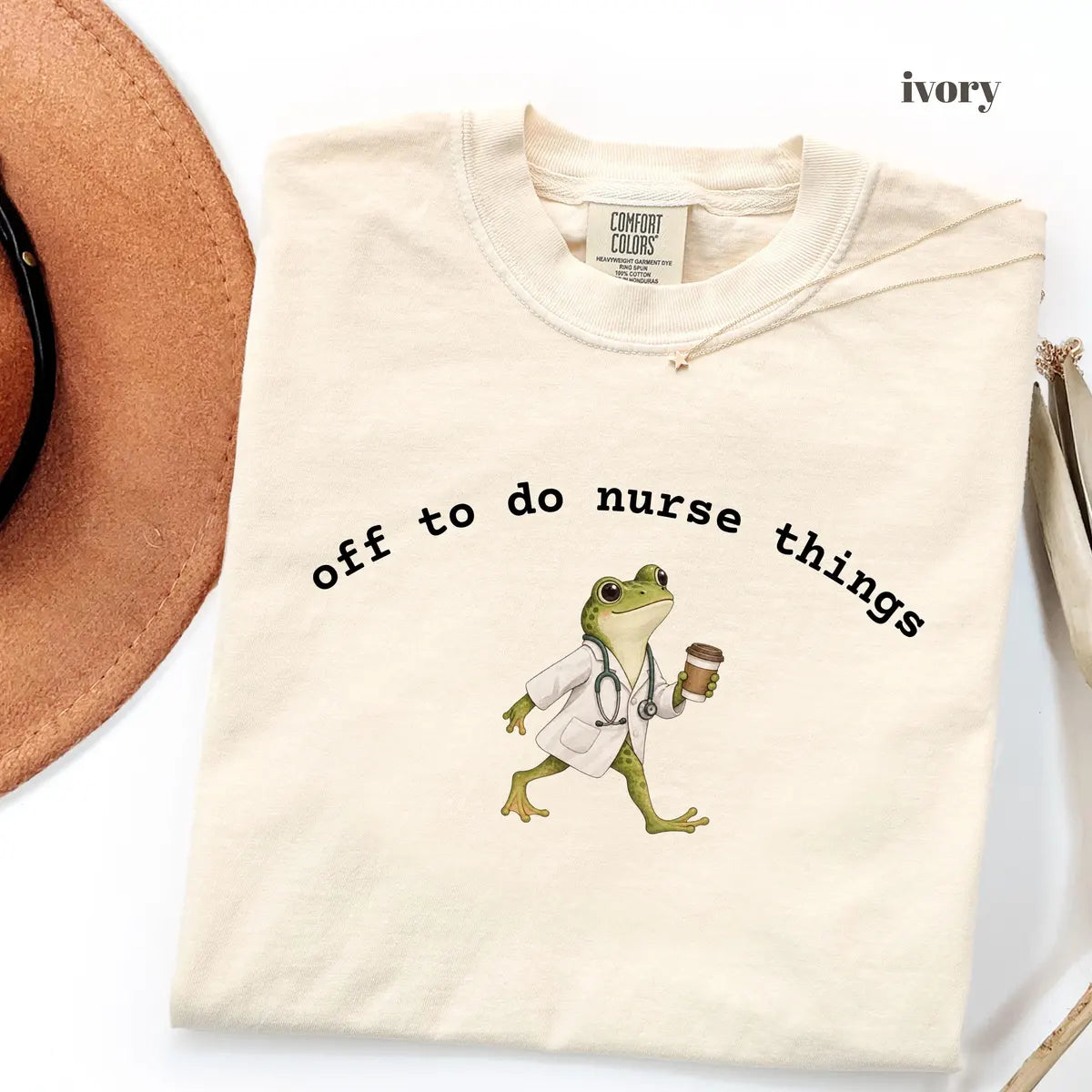 Ivory Comfort Colors 1717 T-shirt with Off to Do Nurse Things design worn by a model