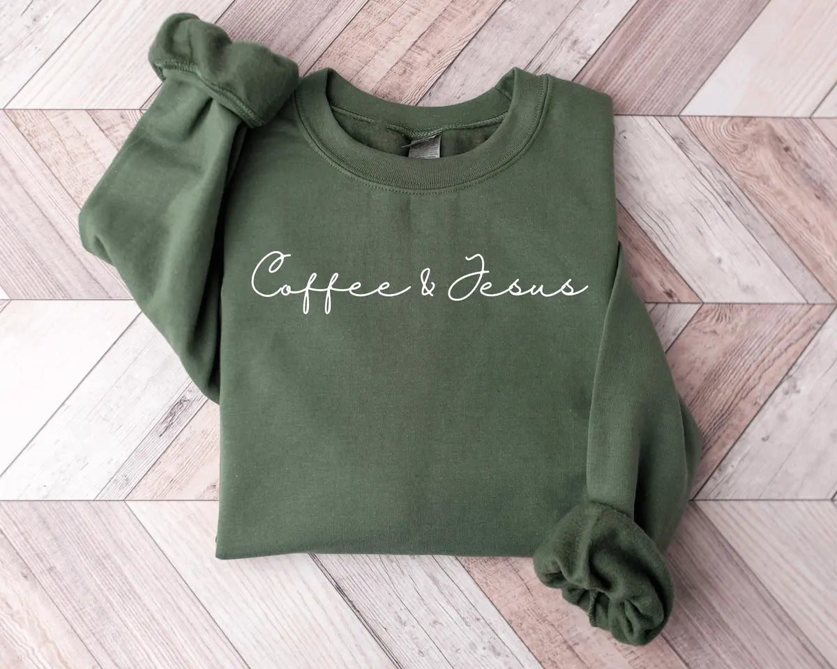 Military Green crewneck sweatshirt with minimal script lettering that reads coffee & Jesus, flat lay view.