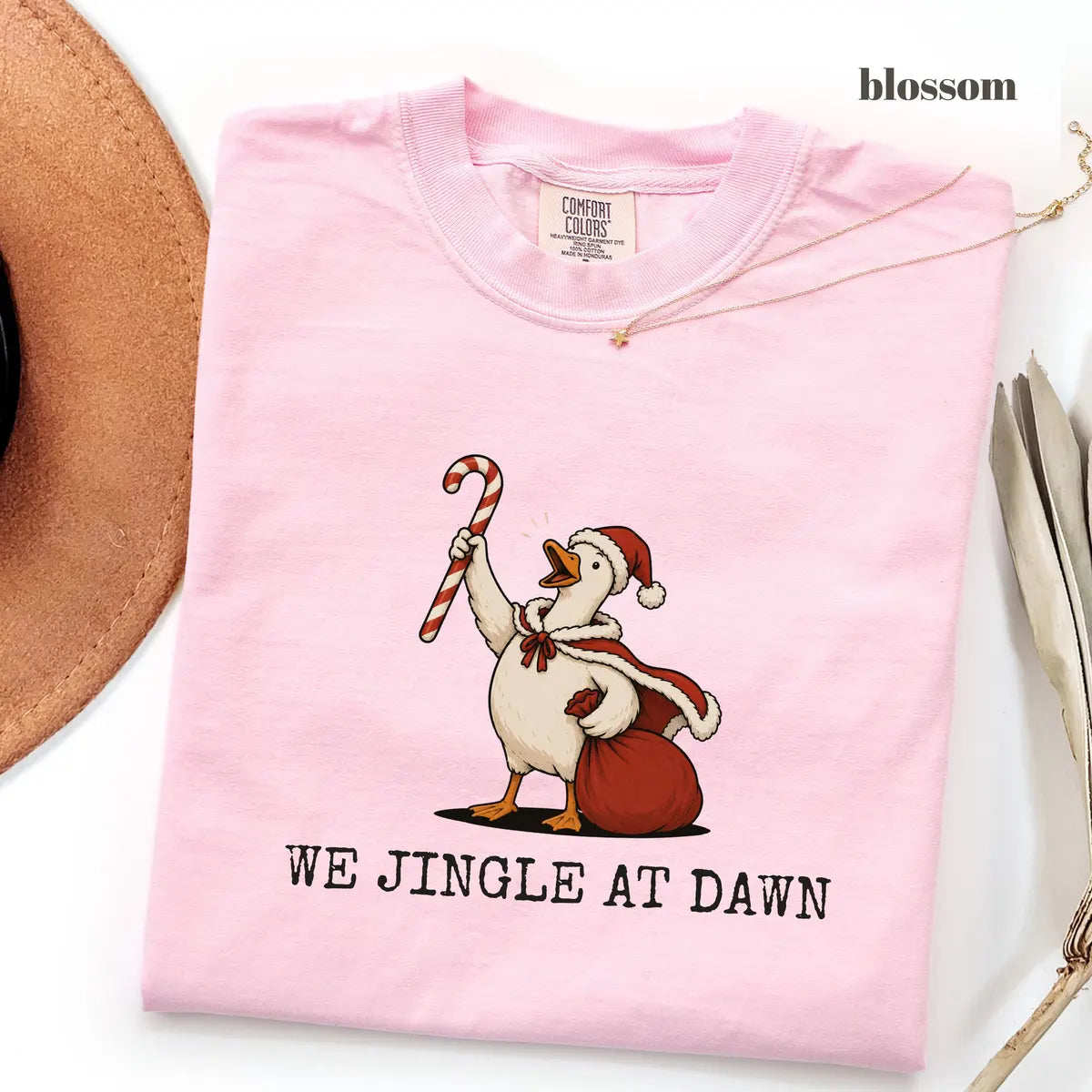 Blossom Comfort Colors 1717 T-shirt with We Jingle at Dawn Christmas design worn by a model