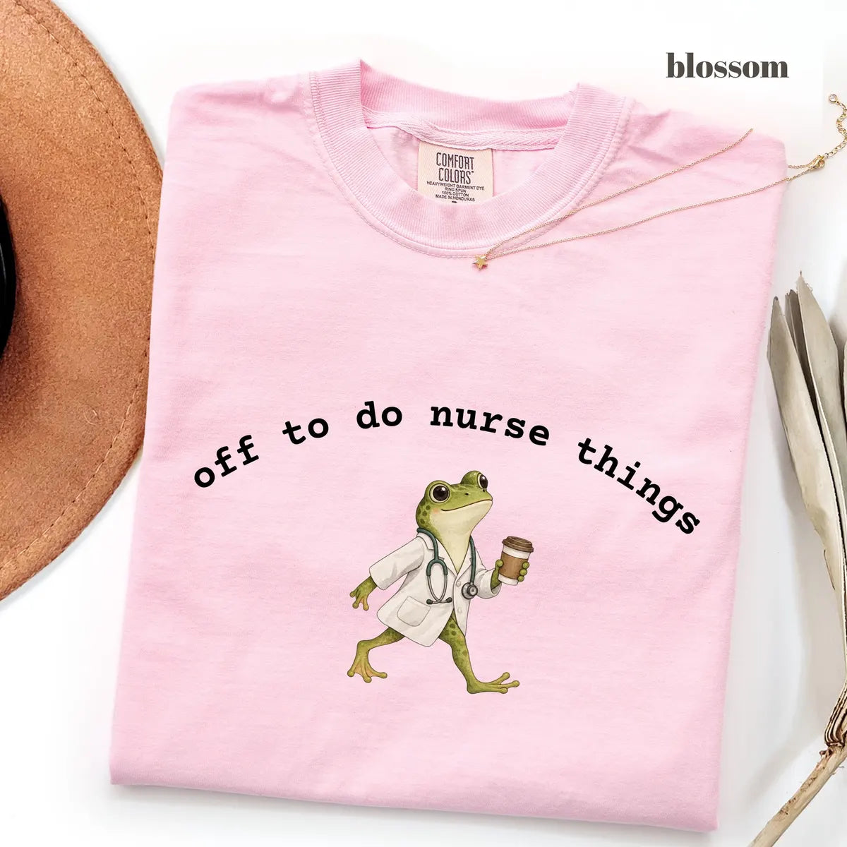 Blossom Comfort Colors 1717 T-shirt with Off to Do Nurse Things design worn by a model