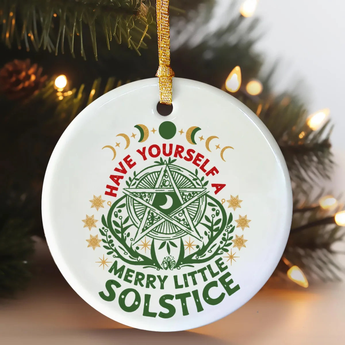 Alternate view of a round ceramic ornament with the visible Blessed Yule message.
