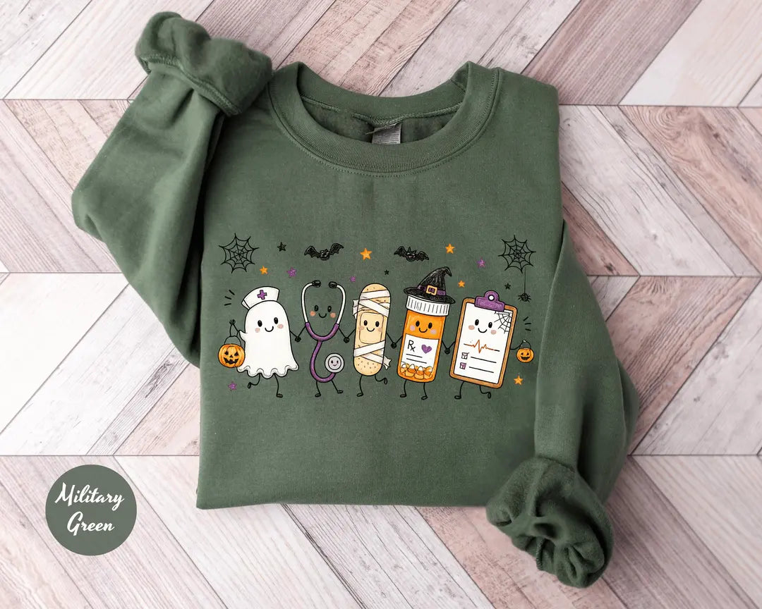 Military Green crewneck sweatshirt with a ghost, stethoscope, bandage and medical chart characters with Halloween details, flat lay view.