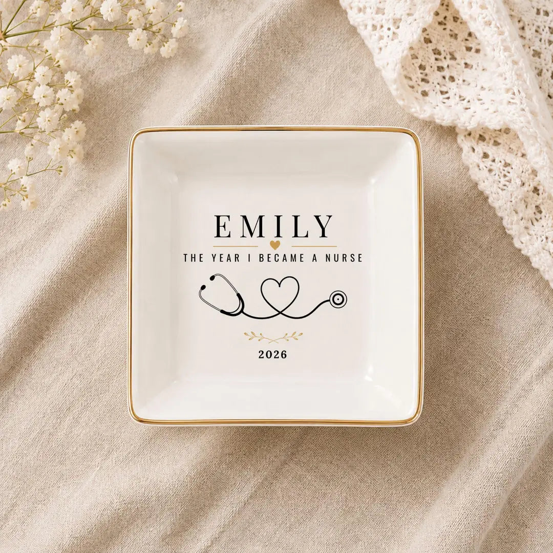 Square ceramic nurse ring dish with gold rim, a name, stethoscope heart design and a year
