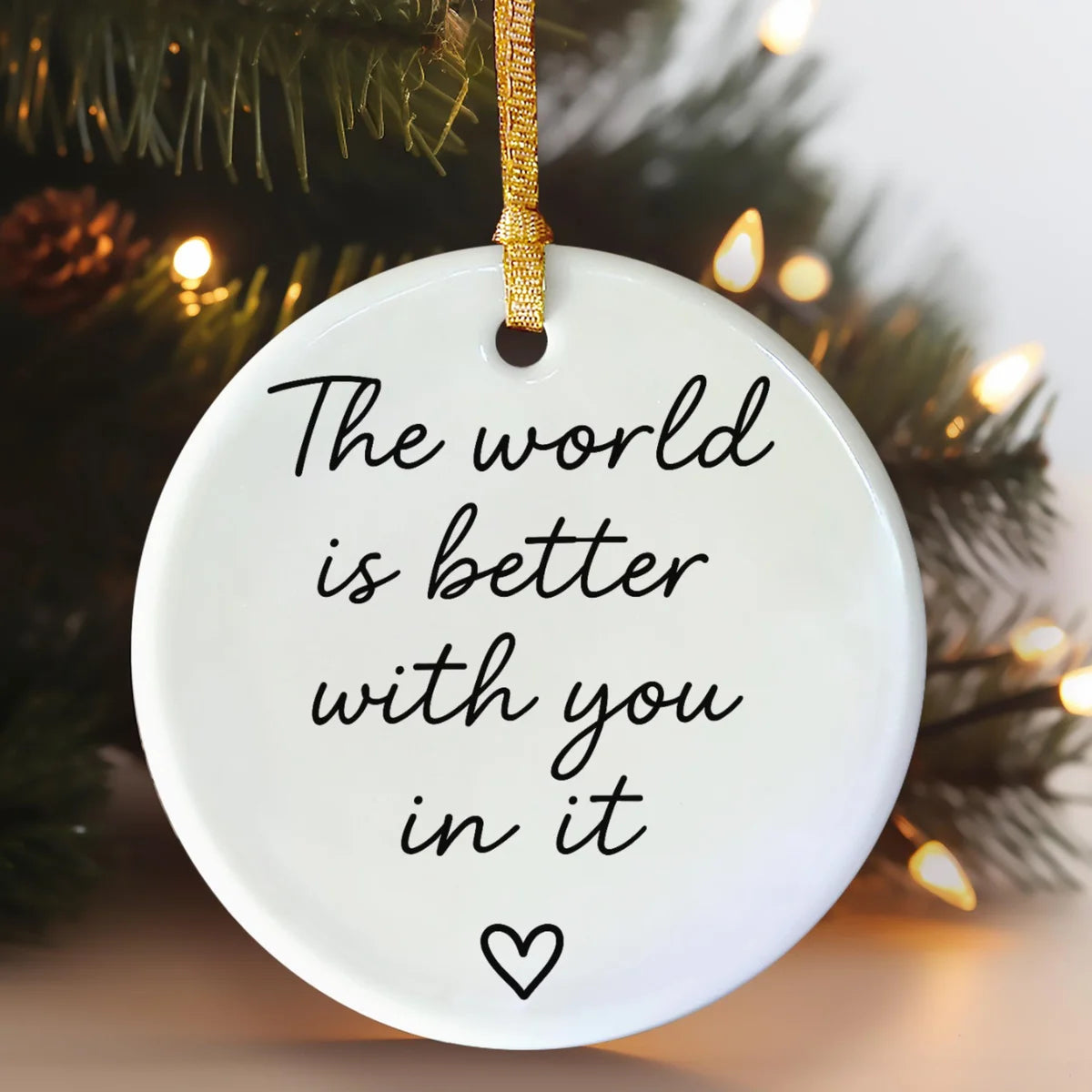 round ceramic ornament with the visible The World Is Better With You in It message.