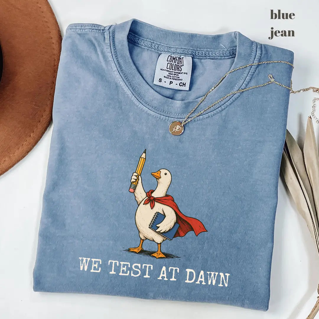 Blue Jean Comfort Colors 1717 T-shirt with We Test at Dawn Teacher design worn by a model