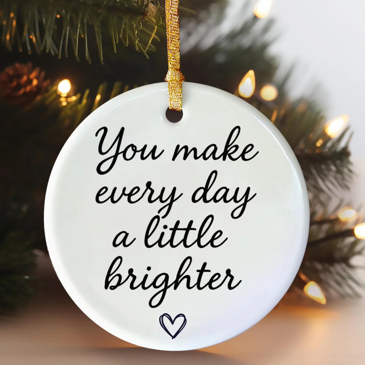 Alternate view of a round ceramic ornament with the visible You Make a Difference Just by Being You message.