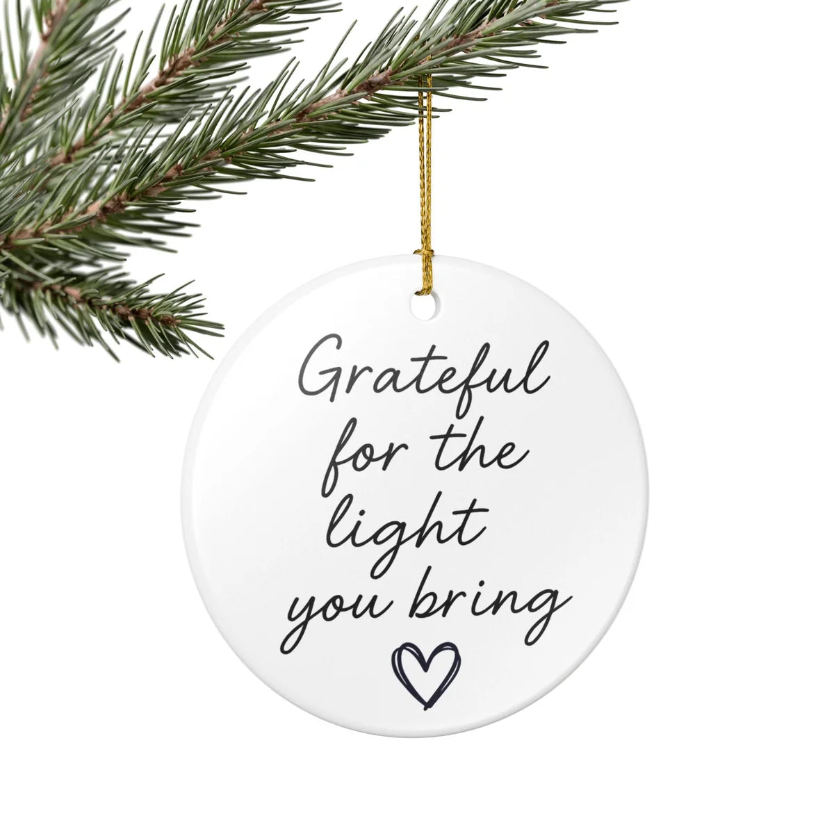 Alternate view of a round ceramic ornament with the visible Grateful for the Light You Bring message.