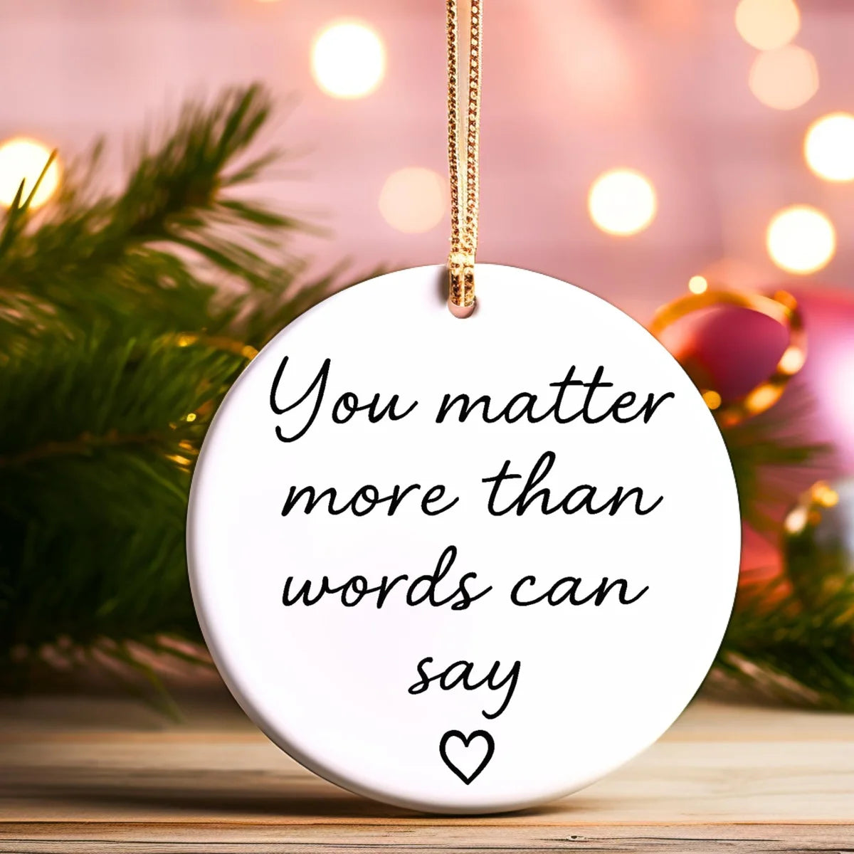 Alternate view of a round ceramic ornament with the visible You Matter More Than Words Can Say message.