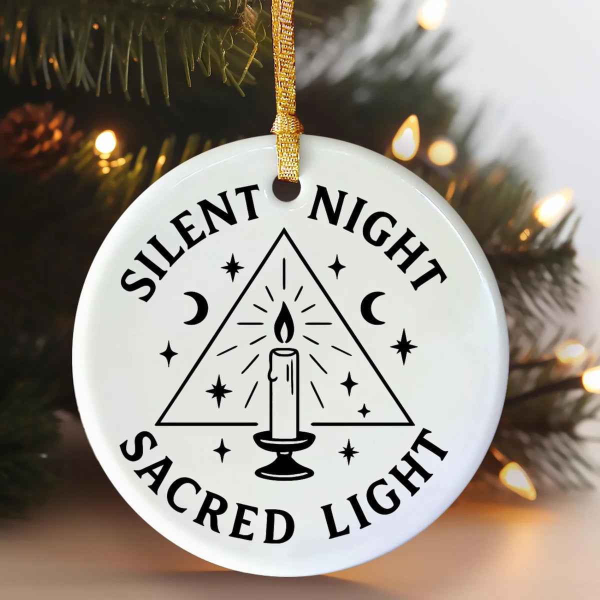 Alternate view of a round ceramic ornament with the visible Blessed Yule message.