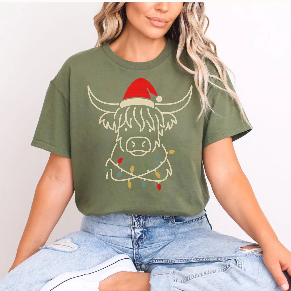 MILITARY GREEN Crewneck sweatshirt with printed Highland Cow Christmas design shown on a model.