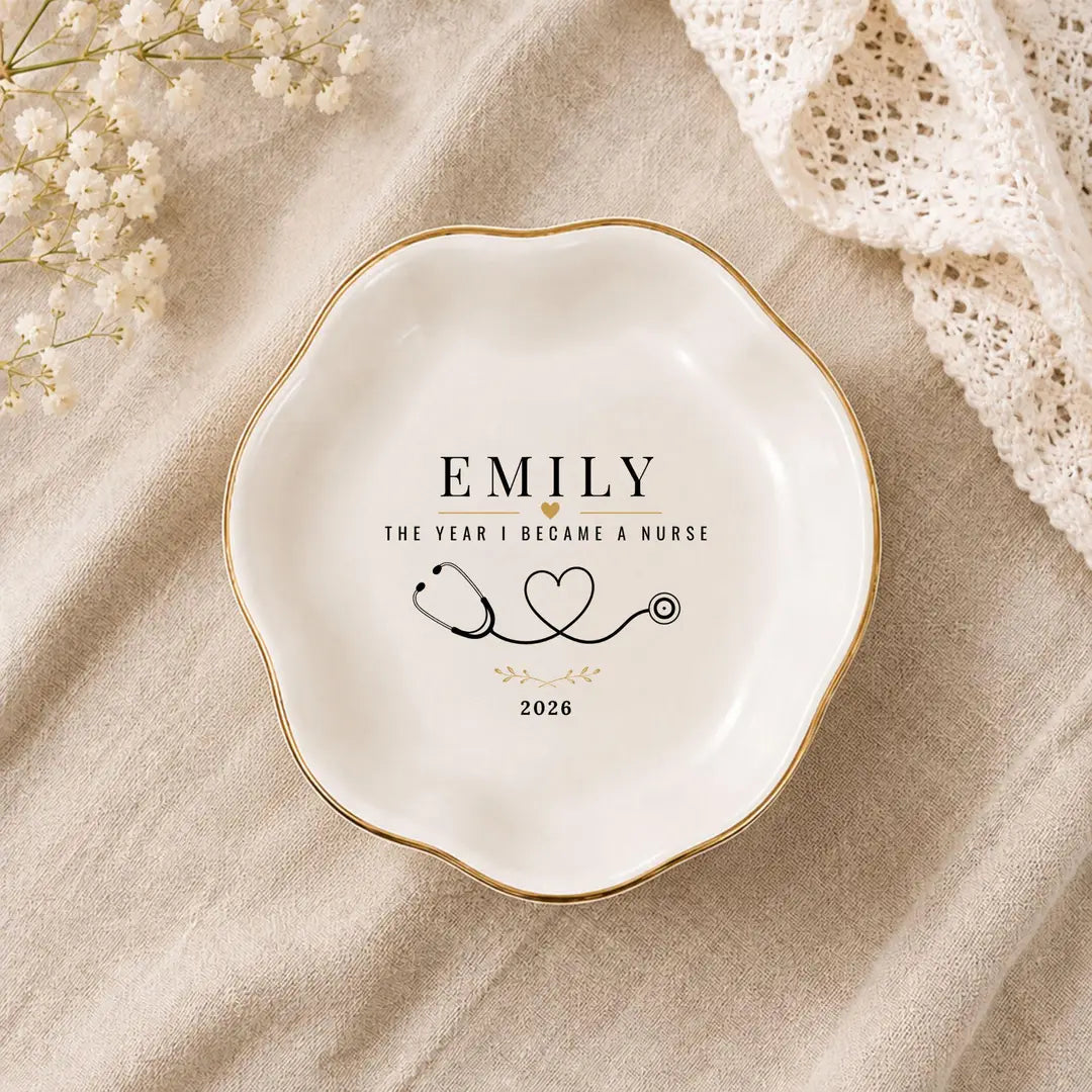 Wavy round ceramic nurse ring dish with gold rim, a name, stethoscope heart design and a year