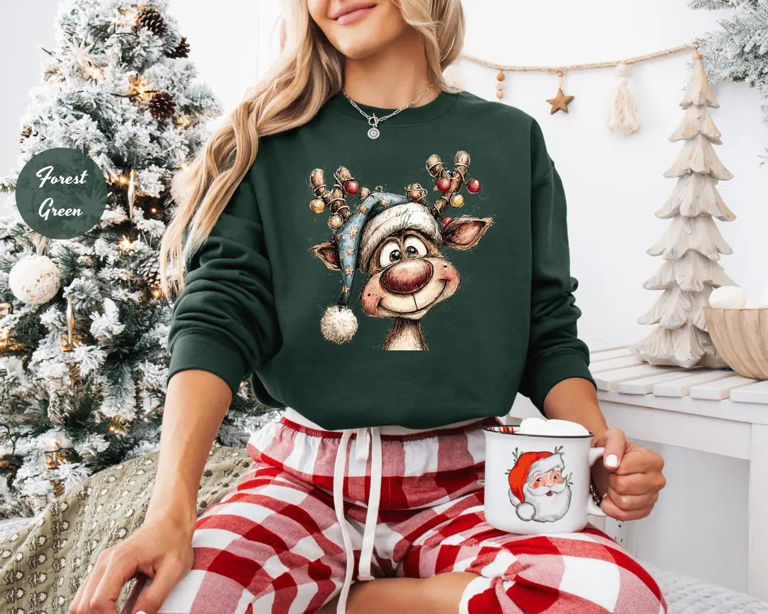 Forest Green crewneck sweatshirt with a retro reindeer wearing a knit hat with ornament antlers, worn by a model.