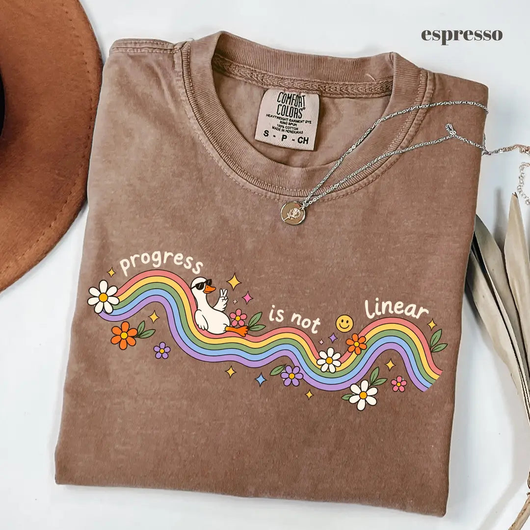 Espresso Comfort Colors 1717 T-shirt with Progress Is Not Linear design worn by a model