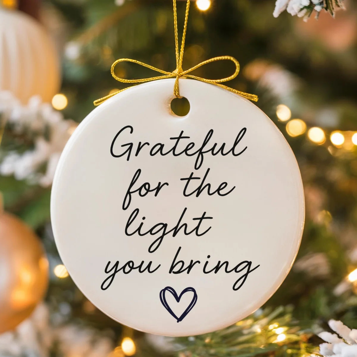 round ceramic ornament with the visible Grateful for the Light You Bring message.