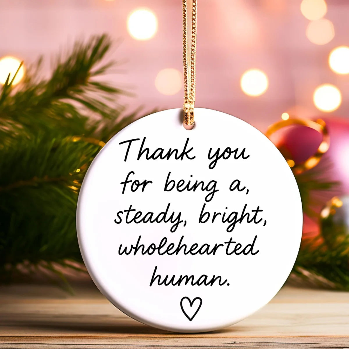 Alternate view of a round ceramic ornament with the visible Steady Bright Wholehearted message.