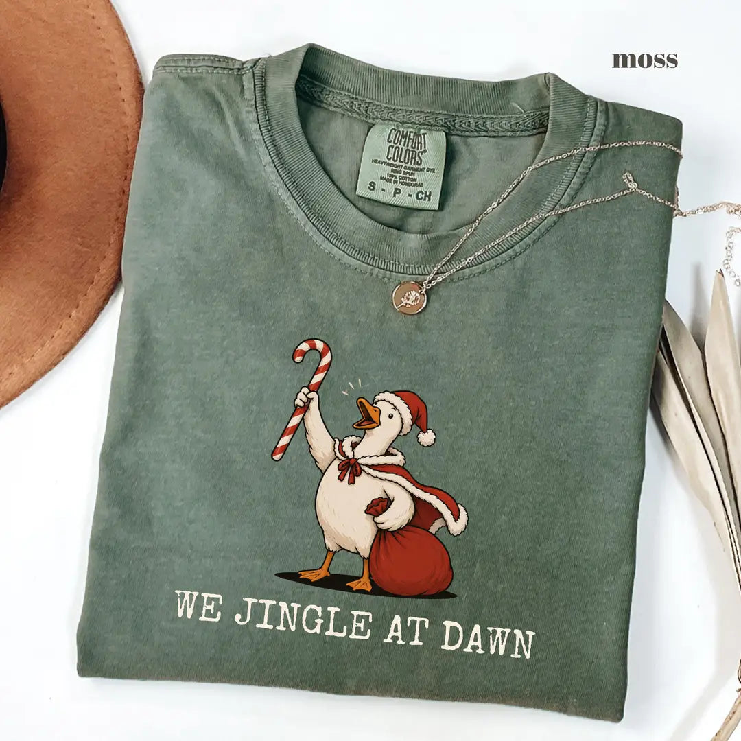 Moss Comfort Colors 1717 T-shirt with We Jingle at Dawn Christmas design worn by a model