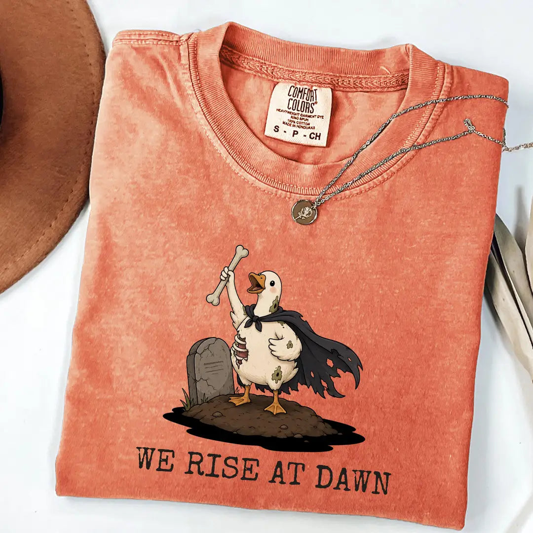 Comfort Colors 1717 T-shirt with We Rise at Dawn Halloween design worn by a model view 2