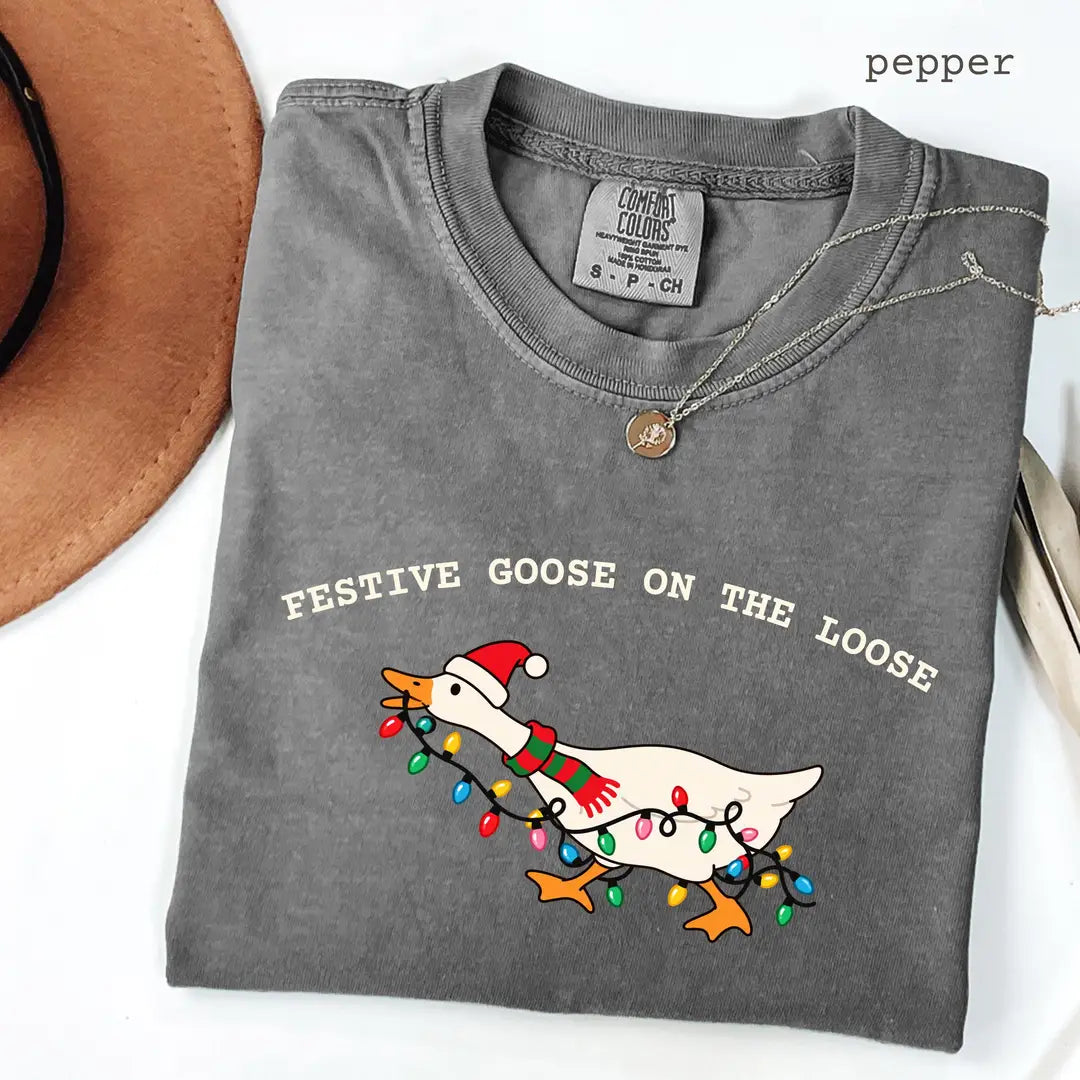 Pepper Comfort Colors 1717 T-shirt with Festive Goose on the Loose Christmas design worn by a model