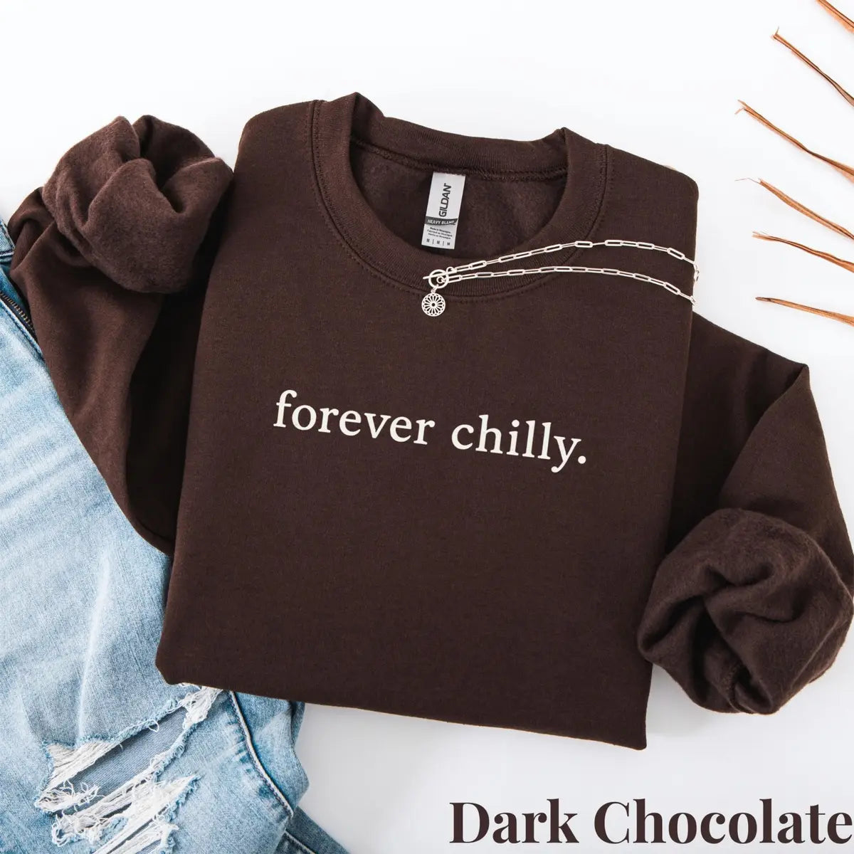 Dark Chocolate crewneck sweatshirt with Forever Chilly printed design.