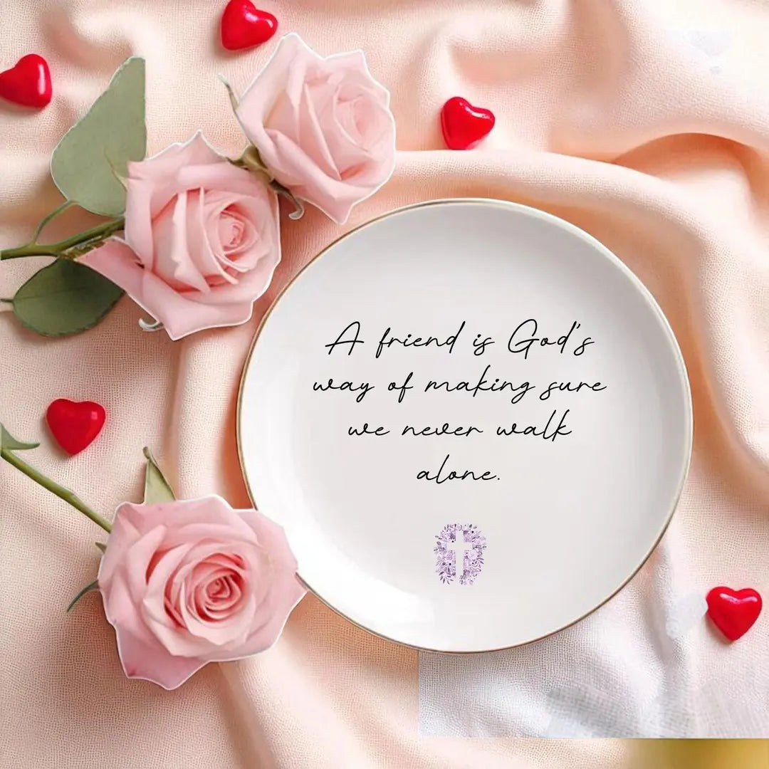 Round ceramic friendship ring dish with the quote and a lilac floral cross, styled with pink roses and red hearts