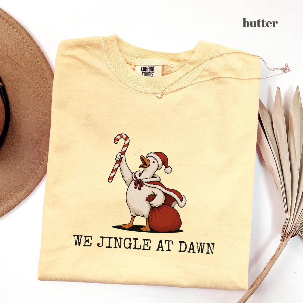 Butter Comfort Colors 1717 T-shirt with We Jingle at Dawn Christmas design worn by a model