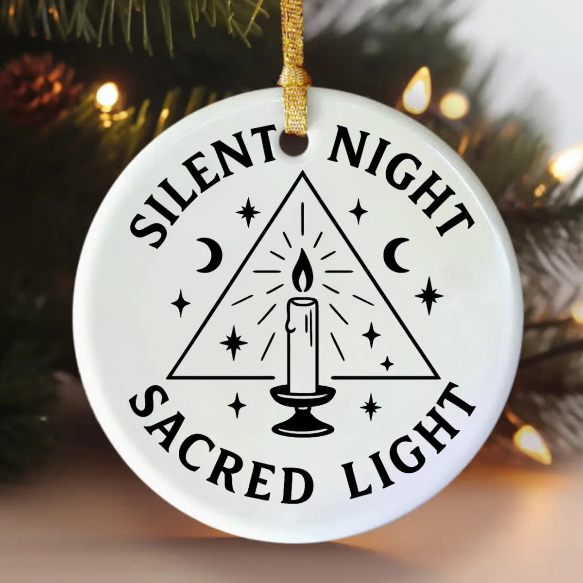Alternate view of a round ceramic ornament with the visible Silent Night Sacred Light message.