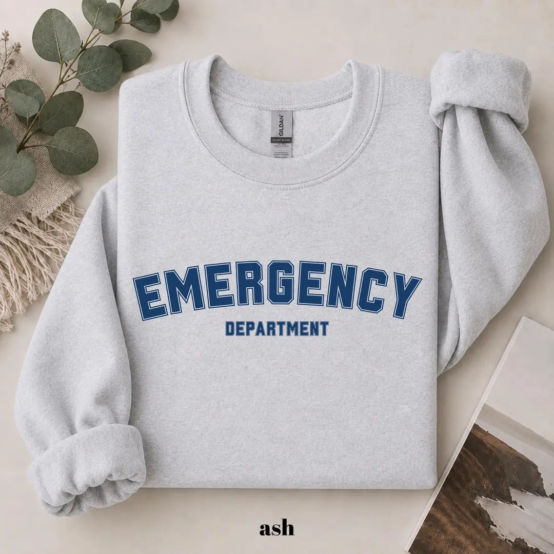 Ash crewneck sweatshirt with printed varsity style emergency department lettering, flat lay view.