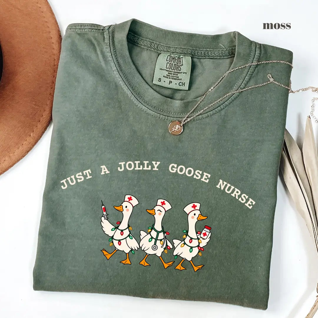 Moss Comfort Colors 1717 T-shirt with Jolly Goose Christmas Nurse design worn by a model