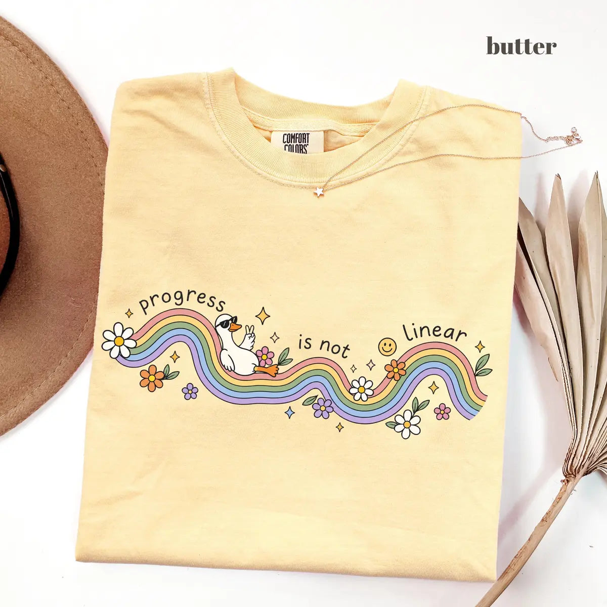 Butter Comfort Colors 1717 T-shirt with Progress Is Not Linear design worn by a model