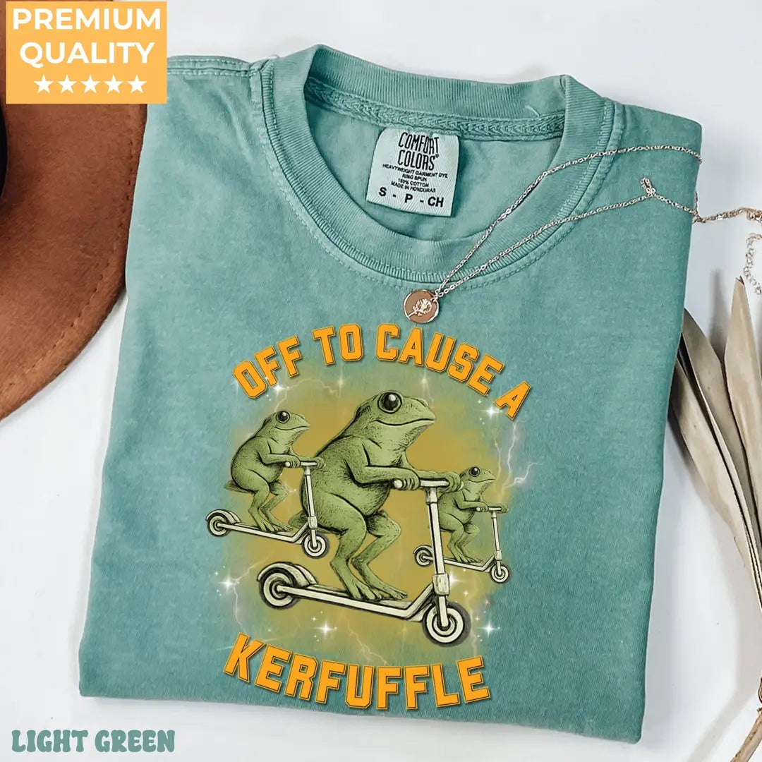 Light Green Comfort Colors 1717 T-shirt with Off To Cause A Kerfuffle Funny Frog Scooter Silly Animal Mental Health Adult Humor Sarcastic design, alternate product view.