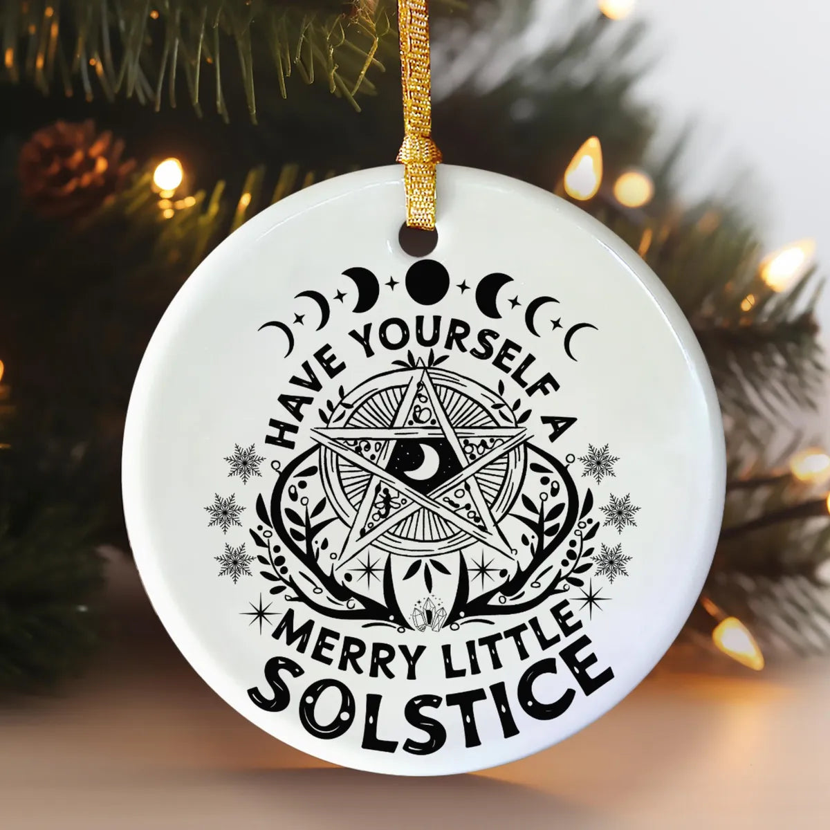 Alternate view of a round ceramic ornament with the visible Blessed Yule message.
